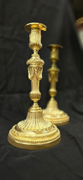 Paire de flambeaux en bronze Louis XVI doré